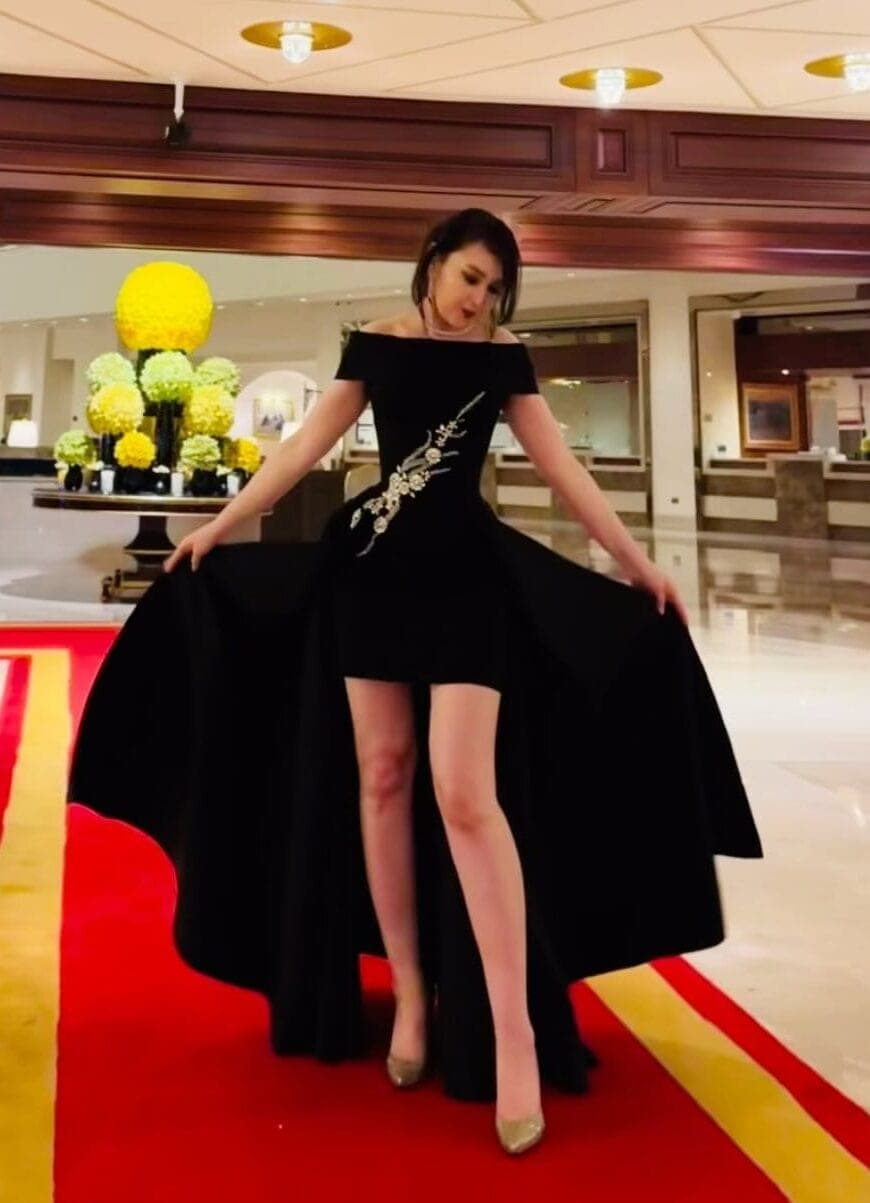 Oko Tilyeukhan in one of her own evening gowns at a red carpet event